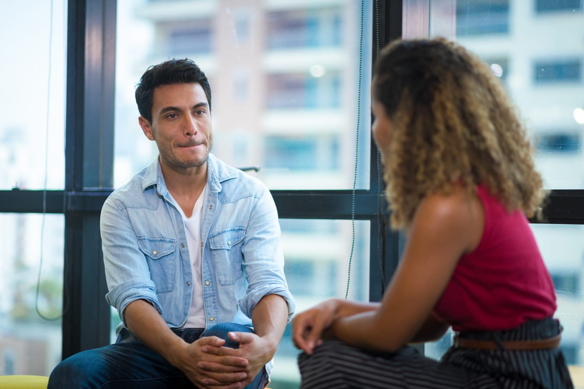 A manager listening warmly and attentively to a colleague